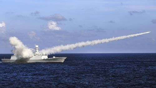 The Chinese missile frigate Yuncheng launches an anti-ship missile during a military exercise in the waters near Hainan Island and the Paracel Islands in southern China.