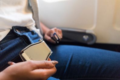Passenger undoes seatbelt on a plane