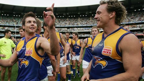 Daniel Chick with Ben Cousins after a win against Richmond in 2005. (Getty)