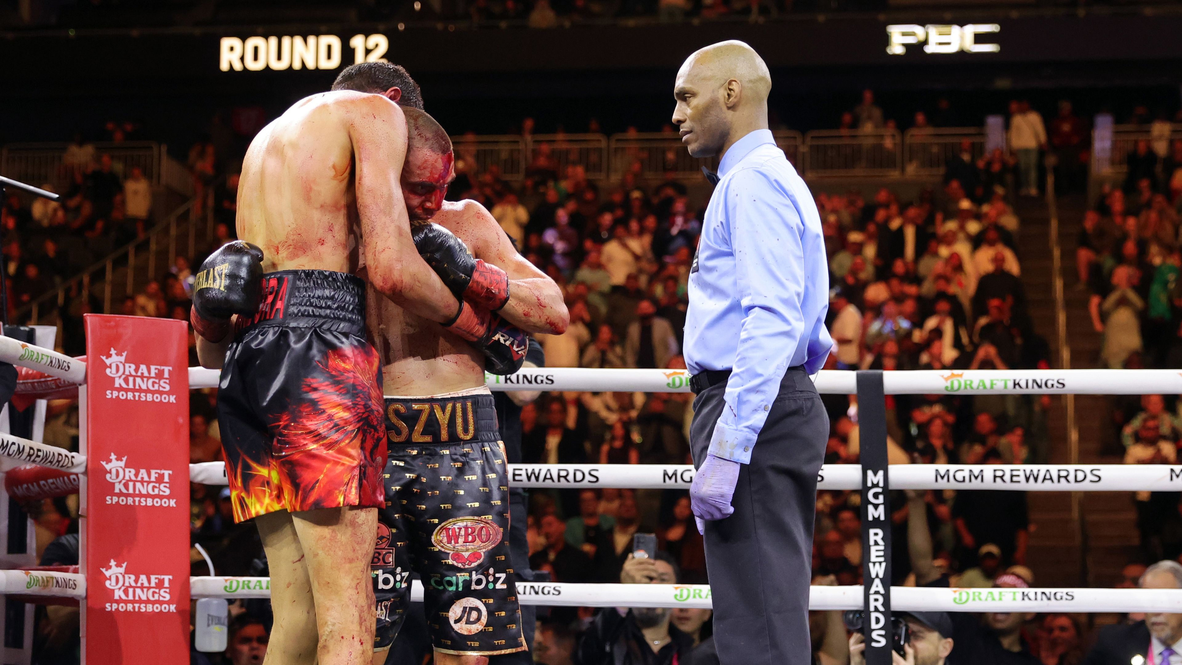 Sebastian Fundora and Tim Tszyu embrace after their 12-round title fight.