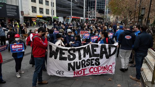 Nurses and midwives arrive for wage meeting and protest against the government wage offer in July 2022.