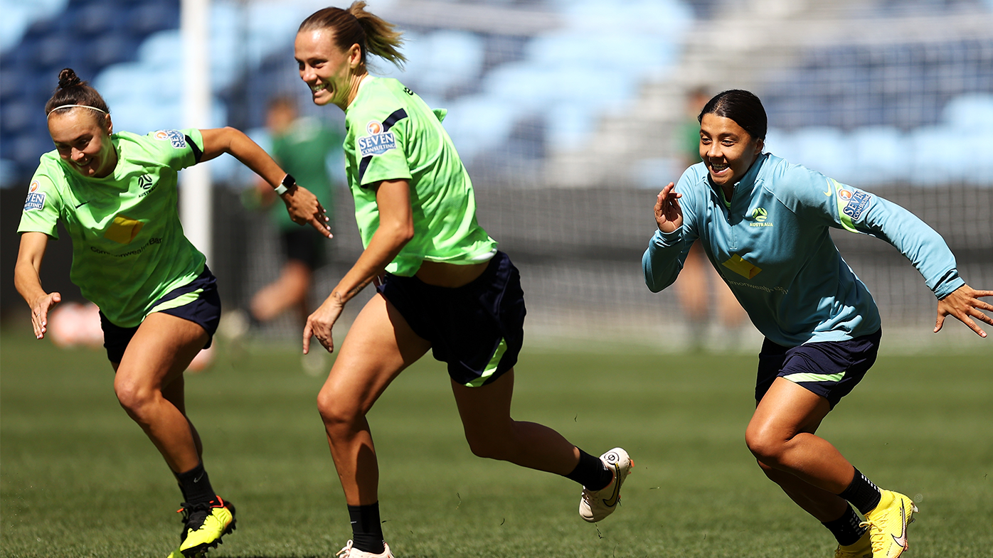 Caitlin Foord, Emily van Egmond and Sam Kerr run during a Matildas training session in September 2022.