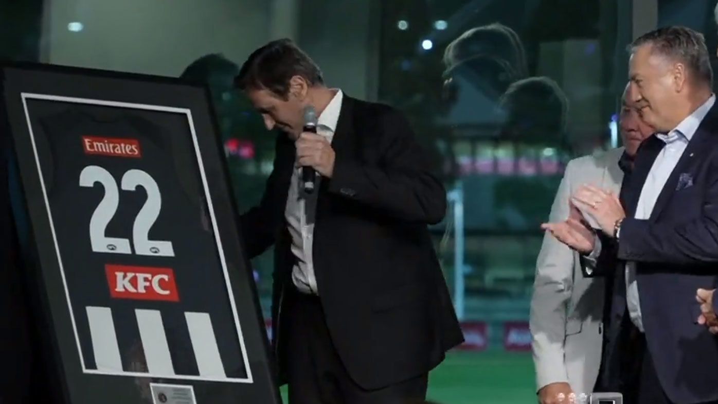 McGuire was handed a framed No.22 jersey to honour his 22 seasons as Collingwood president