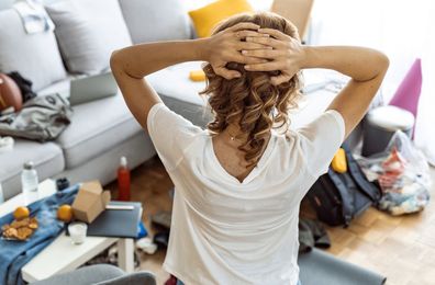 woman frustrated cleaning home