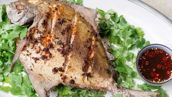 Deep-fried whole black pomfret with lime and chilli dressing