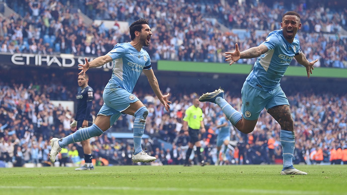 Ilkay Guendogan of Manchester City celebrates after scoring the team&#x27;s third goal against Aston Villa.
