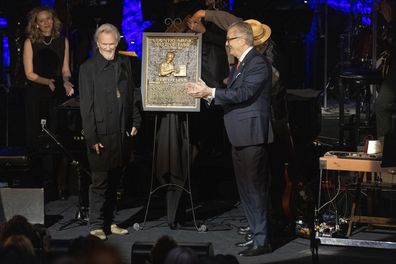 Kris Kristofferson, left, stands with the plaque of honoree Jerry Lee Lewis during the Country Music Hall of Fame Medallion Ceremony on Sunday, Oct. 16, 2022, at the Country Music Hall of Fame in Nashville, Tenn 