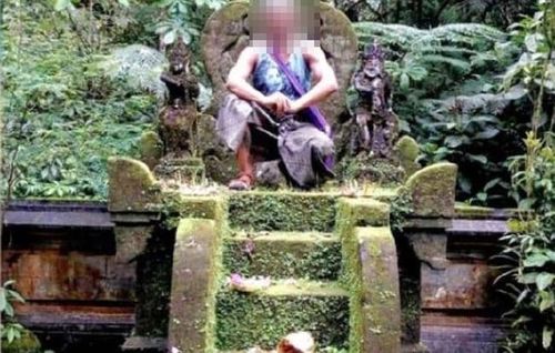 A Danish tourist sparked outrage when he sat on a holy 'throne' that's supposed to be left vacant for Balinese Hinduism's most important deity.