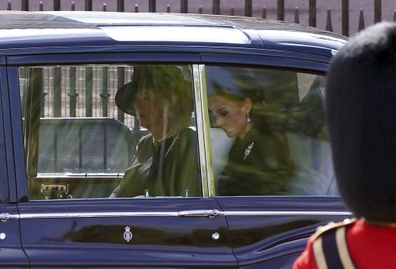 Camilla, the Queen Consort and  Kate, Princess of Wales sit in a car during the ceremonial procession for Queen Elizabeth II from Buckingham Palace to Westminster Hall, London, Wednesday, Sept. 14, 2022. 