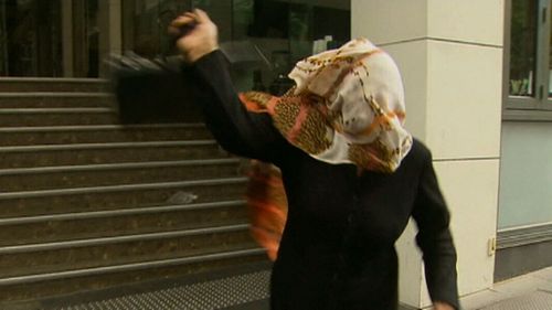 Mr Noori's mother lashes out at a reporter outside court. (9NEWS)