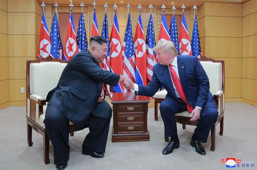 North Korean leader Kim Jong Un, left, and U.S. President Donald Trump shake hands inside the Freedom House on the southern side of Panmunjom, South Korea on June 30, 2019. 