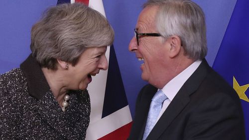 British Prime Minister Theresa May (L) and European commission President Jean-Claude Juncker (R) prior to a meeting in Brussels.