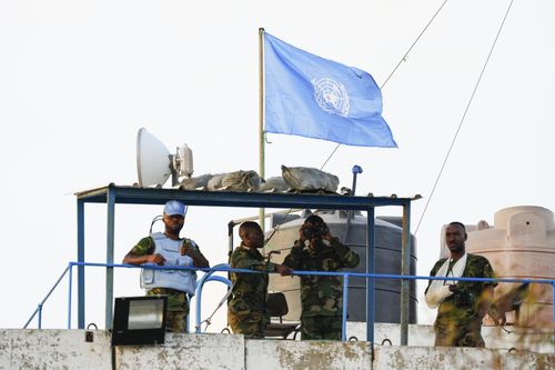 U.N. peacekeepers stand atop a watchtower in the southern village of Marwaheen, Lebanon, Thursday, Oct. 12, 2023. 