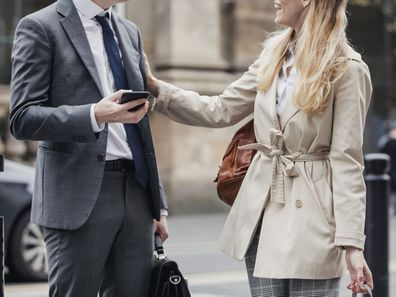 Man and woman chatting on street