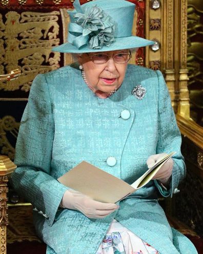 The Queen at the State Opening of Parliament, wearing a Stewart Parvin muted jade coat and printed silk dress.