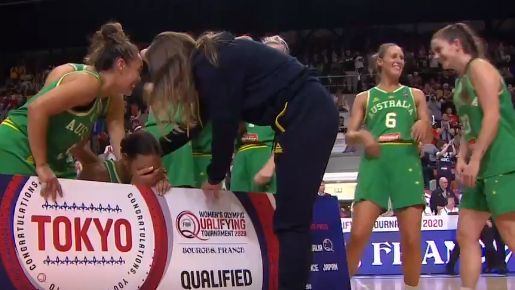 Opals gather around Liz Cambage as she breaks down in tears of relief.