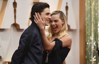 Timothee Chalamet, left, and Margot Robbie arrive at the Oscars on Sunday, Feb. 9, 2020, at the Dolby Theatre in Los Angeles