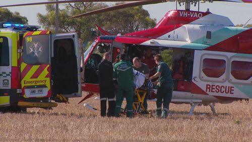 A young woman has been killed and three others are seriously injured after a school bus with no students on board collided with a car north of Adelaide.