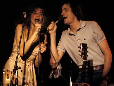 Carly Simon and James Taylor performing together