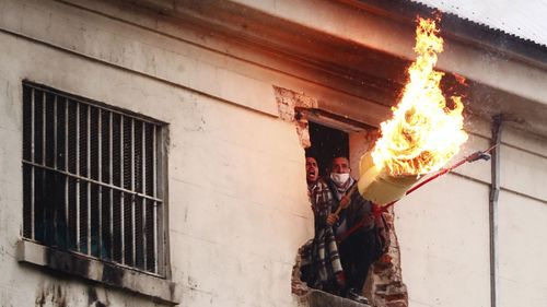 Inmates of Devoto Penitentiary take part in a riot to ask the authorities to take measures to protect them against spread of COVID-19 