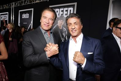Arnold Schwarzenegger and Sylvester Stallone at the Los Angeles premiere of 'Creed' at Regency Village Theater on Thursday, November 19, 2015, in Westwood, California.