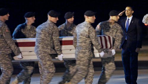 President Barack Obama salutes as an Army carry team carries the transfer case containing the remains of Sergeant Dale R. Griffin during a casualty return at Dover Air Force Base on October 29, 2009. (AP)