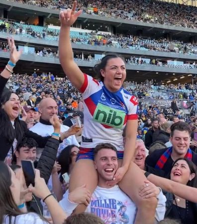 Millie Boyle celebrates a win on Adam Elliott's shoulders.