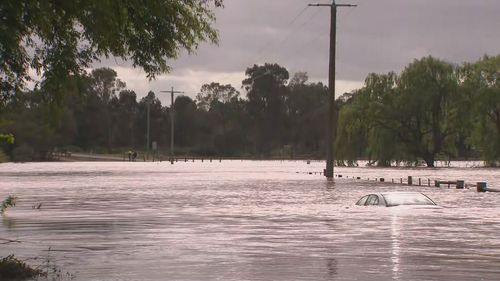 The pair ran into trouble as rivers peaked around Bainsdale but were saved by an SES swift water rescue at 4am.