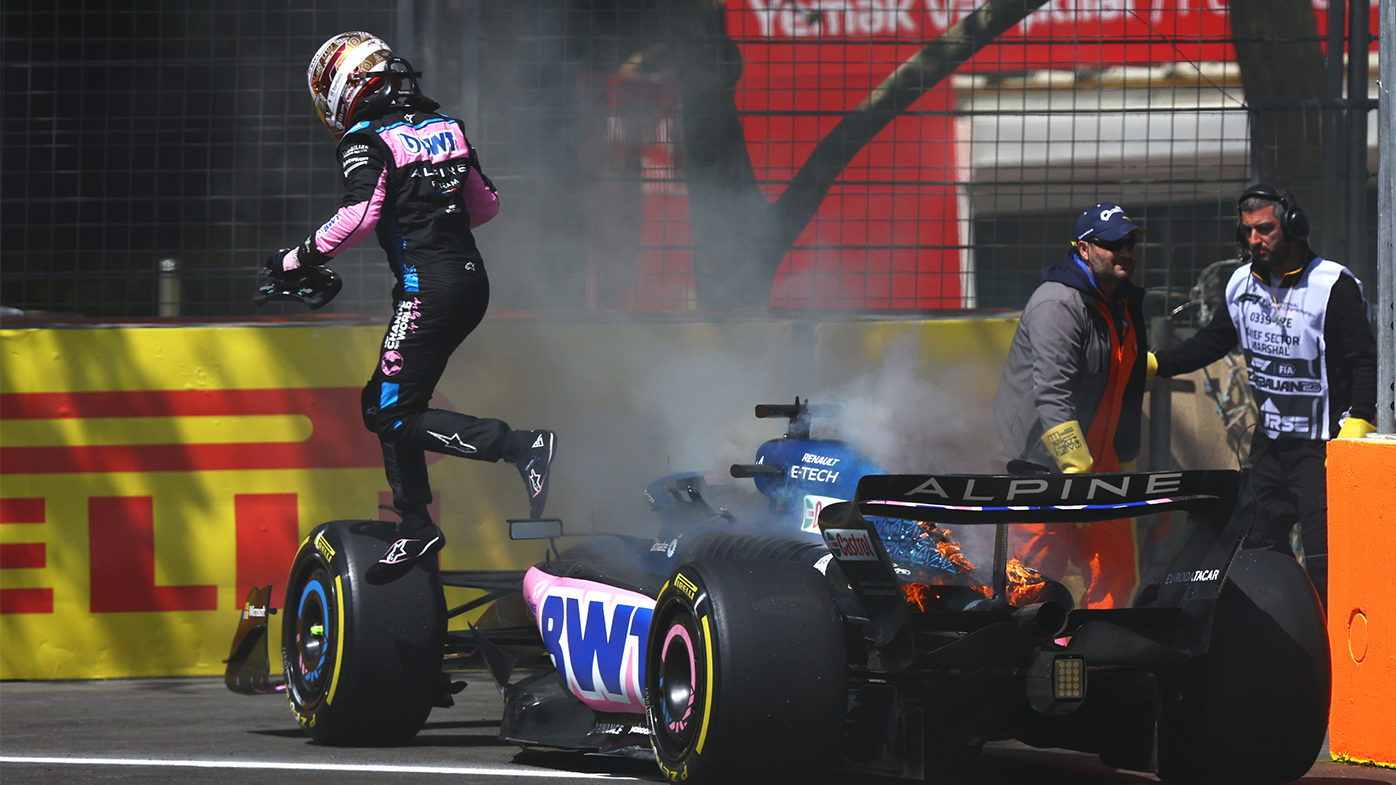 Pierre Gasly leaps from his car after it caught fire during practice for the Azerbaijan Grand Prix. 