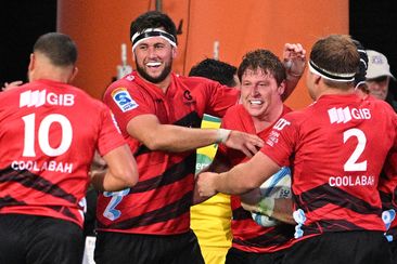 The Crusaders celebrate a try scored Cullen Grace during the round six Super Rugby Pacific match between Crusaders and Chiefs.