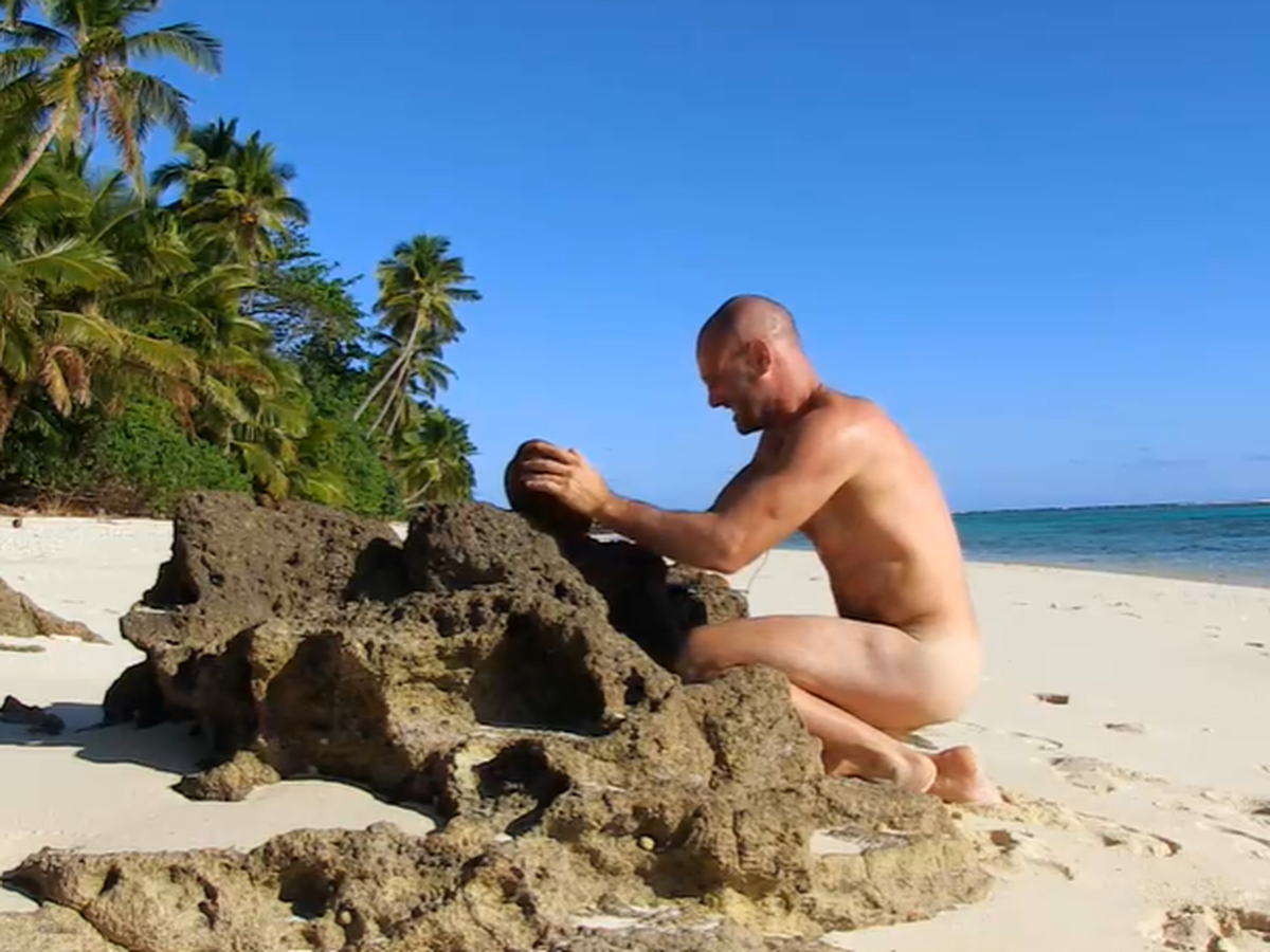 Naked on desert island
