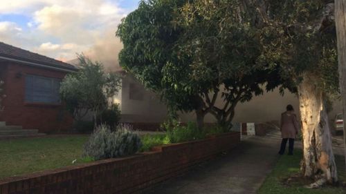 A fire has burnt through the back of a house on Moorefields Road. (9NEWS)