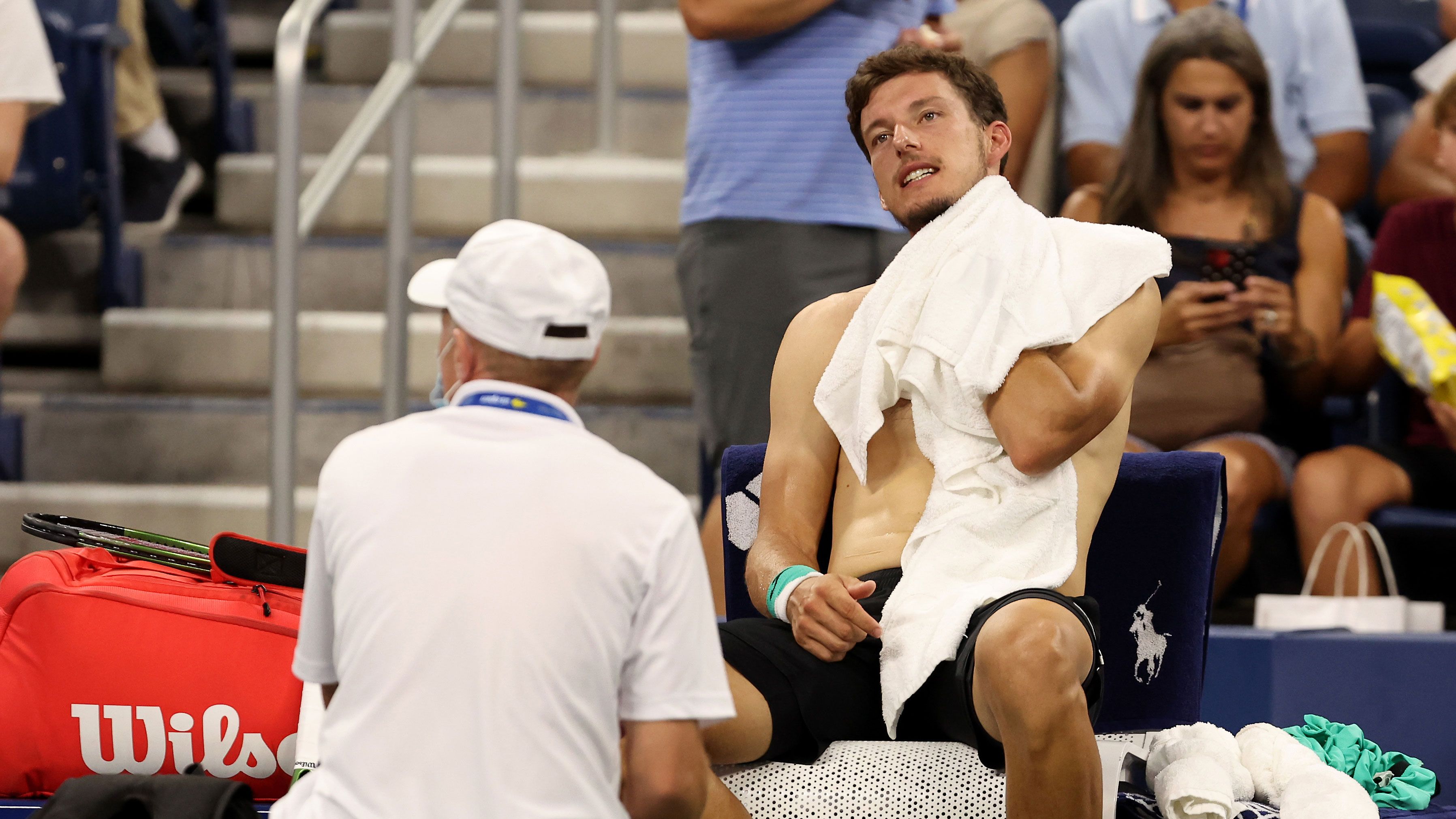 Pablo Carreno Busta cools down against Karen Khachanov of Russia during their fourth round US Open match.