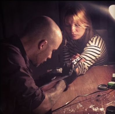 Kate Moss training to be a tattoo artist.