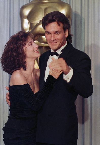 LOS ANGELES, CALIFORNIA - APRIL 11 : Jennifer Grey and Patrick Swayze backstage at the Academy Awards, April 11, 1988 in Los Angeles, California. (Photo by Bob Riha, Jr./Getty Images)