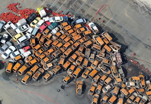 An aerial picture shows burnt cars spread at a yard in Nishinomiya, Hyogo Prefecture, western Japan