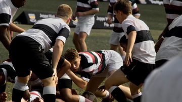 High school students play rugby union.