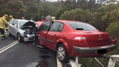 Crash in Sydney’s south leaves car hanging over edge of a bridge