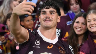 Centre: Herbie Farnworth poses for a selfie with Broncos fans after the team's qualifying final win over the Storm.
