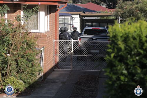Police searched the Seven Hills home and seized clothing, documents and more than $15,000 cash.