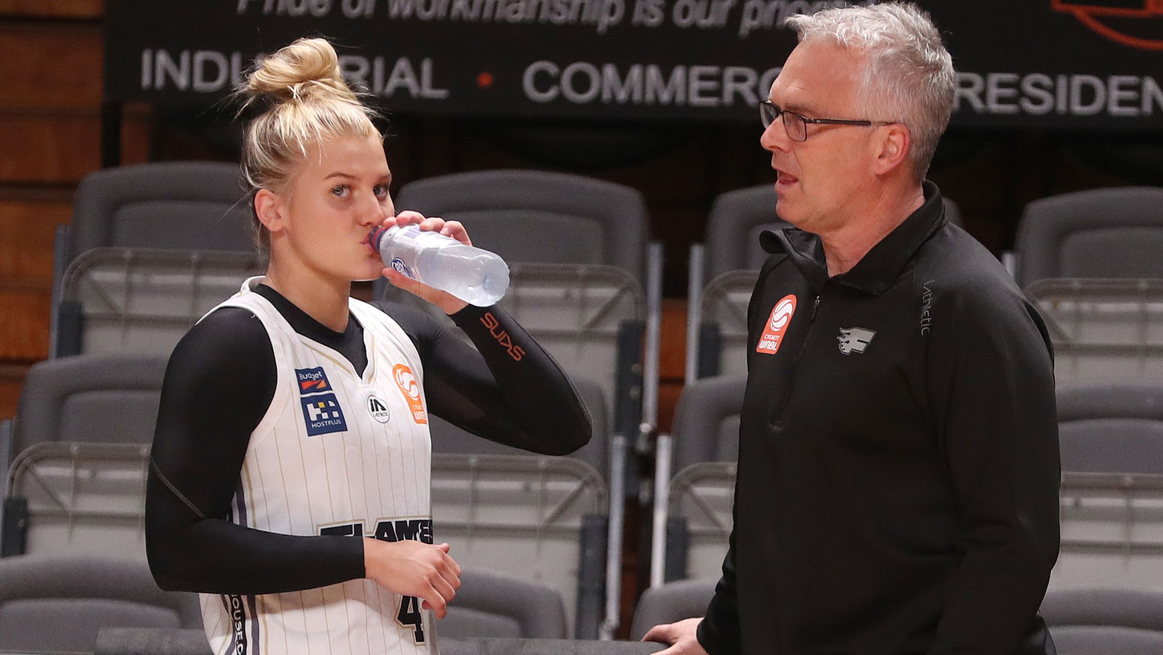 Point guard Shyla and senior coach Shane Heal of the Sydney Flames.