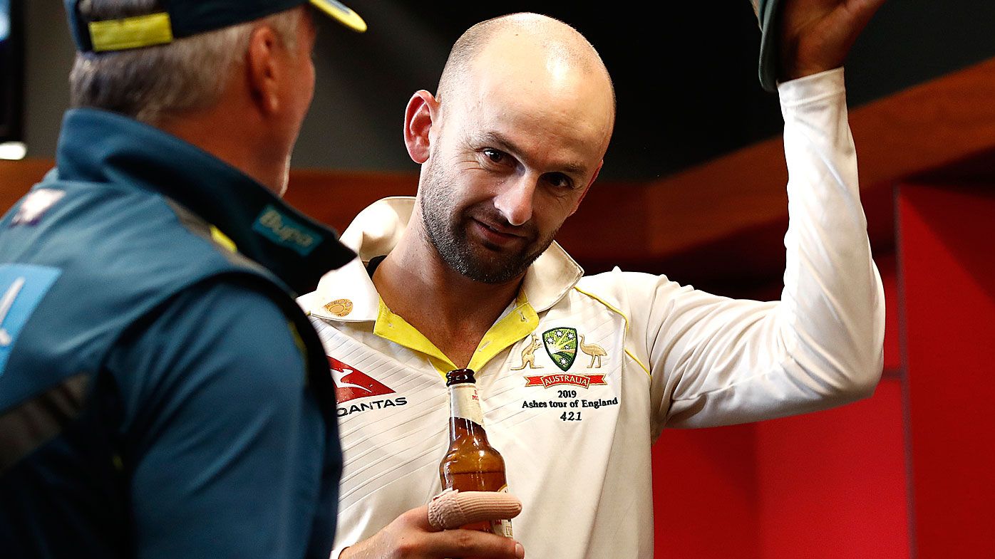 Nathan Lyon celebrates in the change rooms 