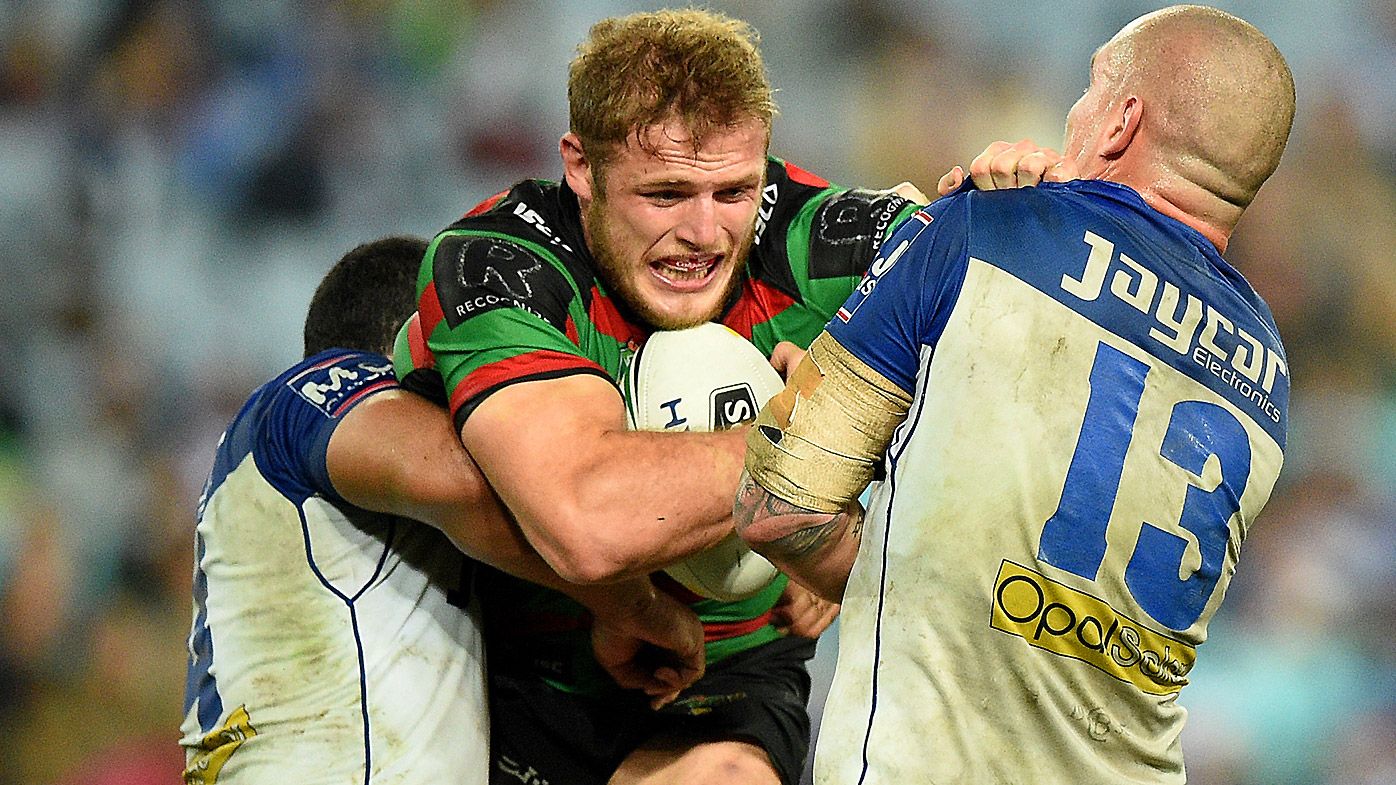Thomas Burgess of the Rabbitohs is tackled by David Klemmer of the Bulldogs
