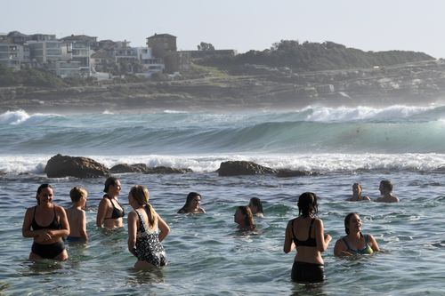 Beachgoers cool off at Bronte Beach in Sydney.
