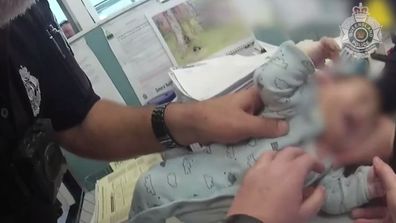 The 10-week-old baby arrive unresponsive in his mother's arms at the Queensland police station. 