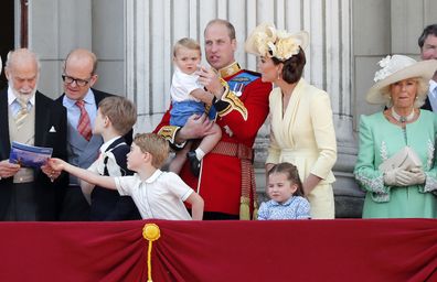 Britain's Prince William and Kate, the Duchess of Cambridge with their Prince George, center left, Princess Charlotte, center right, and Prince Louis, top center, attend the annual Trooping the Colour Ceremony in London, Saturday, June 8, 2019. (AP Photo/Frank Augstein)