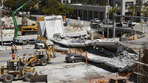 The new pedestrian bridge that was under construction collapsed onto a busy Miami highway last Friday (AAP).