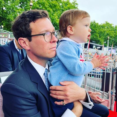 Jack Brooksbank holds son August Brooksbank in Platinum Jubilee pageant