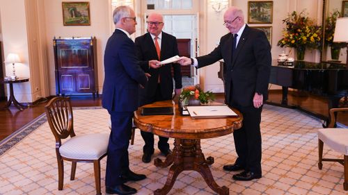 The bill being presented to Sir Peter Cosgrove (AAP)