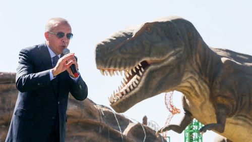 President Recep Tayyip Erdogan speaking at a dinosaur theme park.